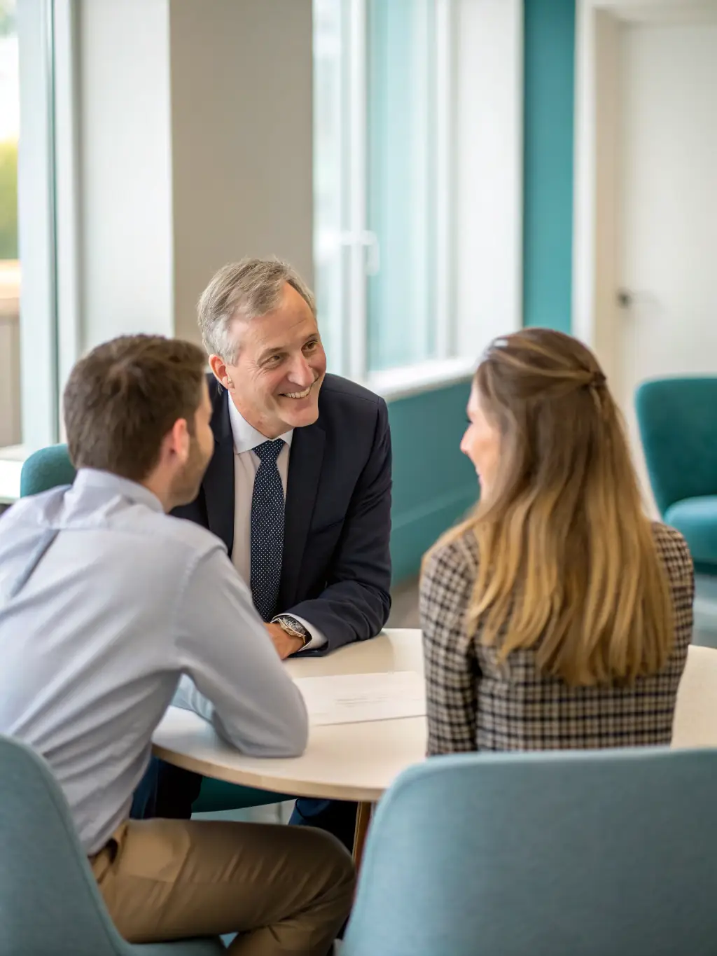 A mediator guiding a discussion between two individuals at a table, fostering a calm and collaborative atmosphere.
